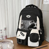 A black and white Kawaii Harajuku backpack with a laptop compartment displayed on a wooden surface.