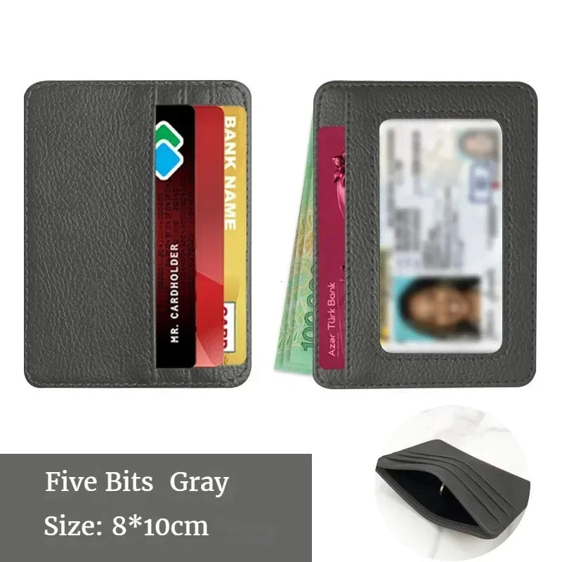 A dark gray slim PU leather mini wallet holding an ID card and bank name card.