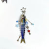 A silver simulation fish keychain with a star charm and dangling beads.