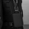 Close-up of a black RFID zipper wallet attached to a dark backpack strap.