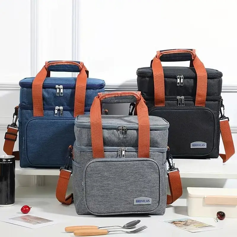 A gray insulated double-layer lunch bag with orange straps is displayed on a white surface.