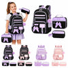 A set of three cartoon-themed school bags for girls in black and purple colors.