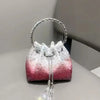 A pink and white crystal-embellished evening clutch with a silver chain and hoop.