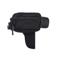 Black tactical concealed carry waist pack with a zippered pouch and adjustable strap.