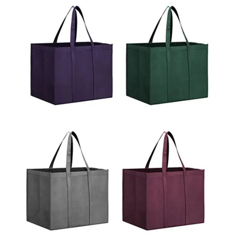 A set of six reusable foldable grocery tote bags in purple, green, and gray fabric.