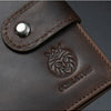 A dark brown leather wallet with an embossed lion head design and stitching.