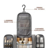 A gray hanging toiletry bag with multiple compartments and accessories, shown in a vertical view.