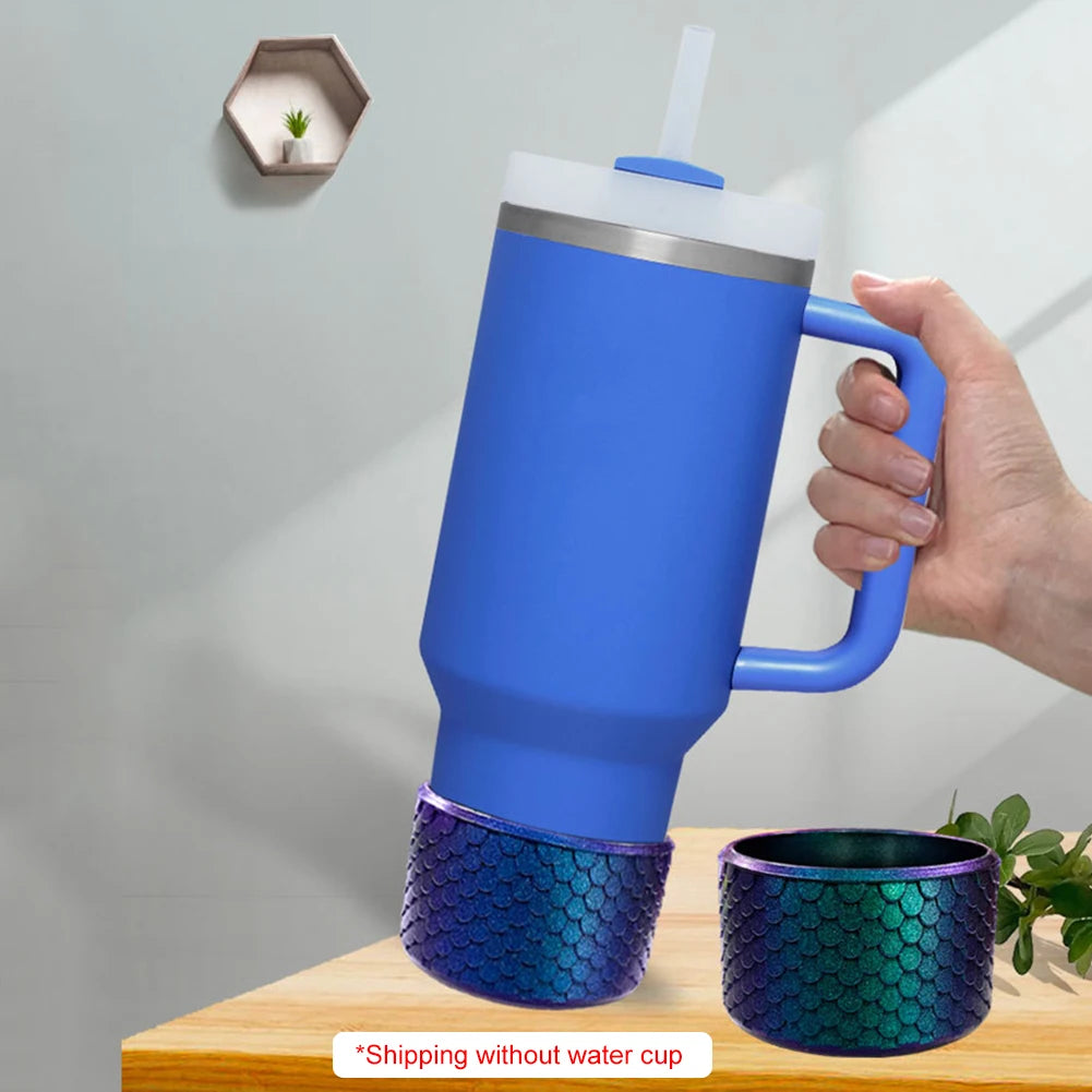 A blue silicone boot sleeve fits over a water bottle, shown next to a wooden surface.