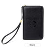 Black RFID blocking travel passport holder with a leather strap and gold accent.