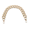 A beige acrylic chunky chain shoulder strap for a handbag.