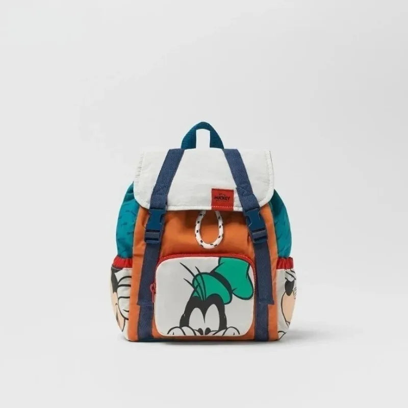 A women's cow print fashion backpack in white and blue fabric.