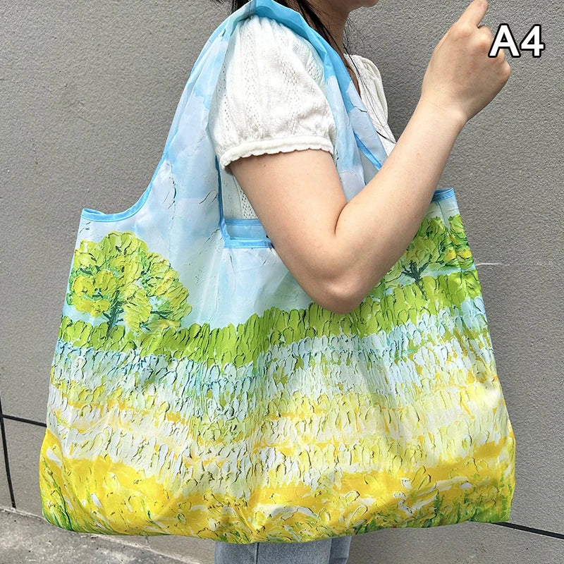 A woman holds a large, translucent green and yellow nylon shopping tote with a light blue strap against a gray background.