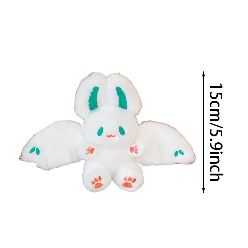A white bat bunny plush toy with green accents and soft wings, shown against a white background.