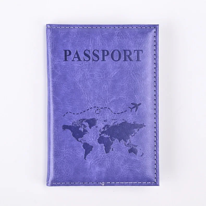 A purple leather passport holder with the word PASSPORT and a world map design.