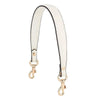A white and black elegant PU leather detachable handbag strap with gold hardware.