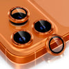A close-up view of a glitter diamond camera lens protector with a metal frame resting on a smartphone.
