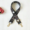 Black patterned nylon bag strap with gold hardware