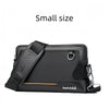 A small black leather crossbody bag with an adjustable strap shown in a flat lay view.