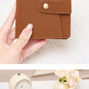 A brown compact bifold wallet with a zipper, showing various credit cards and an RFID blocking feature.