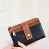 A brown leather multi-slot wallet is displayed in a hand against a light background.