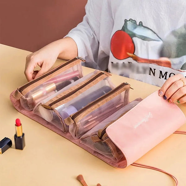 Un sac de maquillage rose portable et amovible ouvert sur une surface claire à côté d'une personne portant une chemise blanch