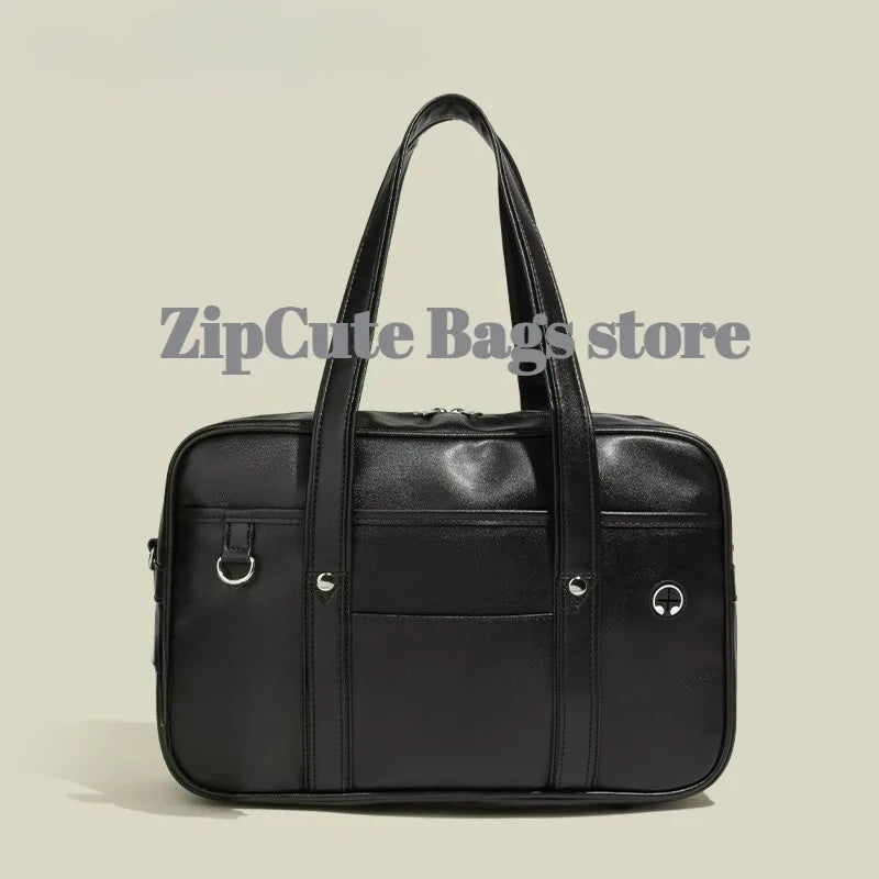 Black waterproof PU leather student messenger bag with silver hardware