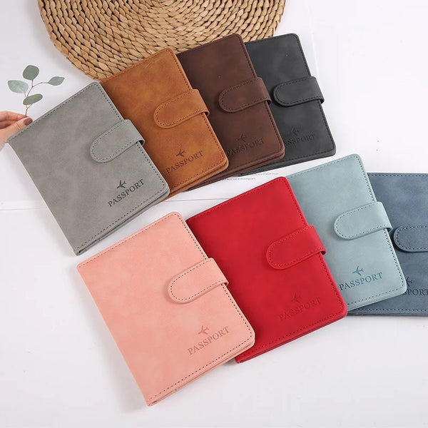 A collection of waterproof leather passport holders in various shades including brown, gray, black, and red, displayed on a w