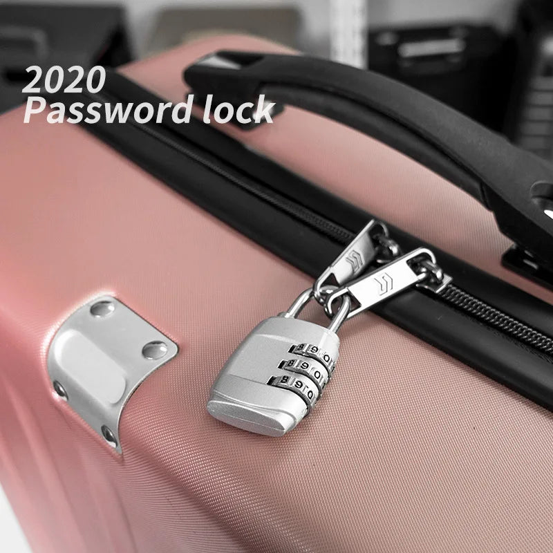 A silver 3-dial combination padlock is attached to a pink suitcase zipper, demonstrating a 2020 password lock.