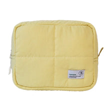 A yellow aesthetic quilted puffer makeup bag.