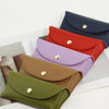 A collection of five PU leather hard shell sunglasses cases in various colors including navy blue, red, purple, olive green, 