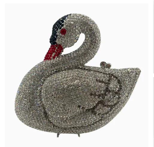 Pochette à clochette en argent avec cygne, design détaillé et accents rouges.