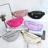 A collection of pink, purple, and black lightweight nylon crossbody fanny packs displayed on a white surface.