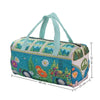 A teal quilted travel duffle bag with light blue handles and floral embroidery.