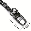 A close-up view of a black metal chain strap with a clasp and measurement markings.