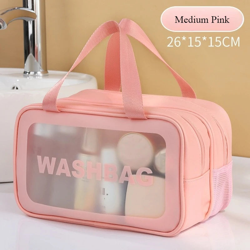 Medium pink double-layer clear and dry wash bag with pink straps shown on a white surface.