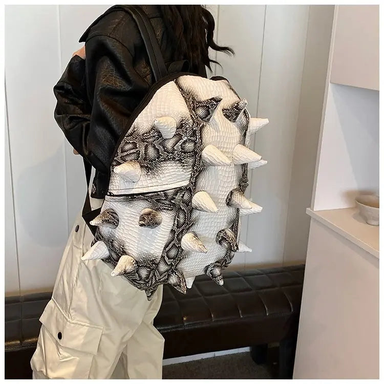 A black and white hedgehog shaped PU backpack worn by a person.