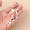 Silver pearl bow heart keychain with dangling charms for bags and keys