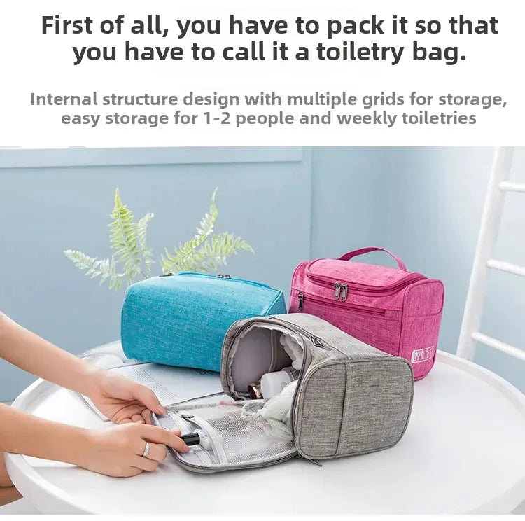 A hand is opening a gray portable toiletry bag, showing its internal structure and storage grids.