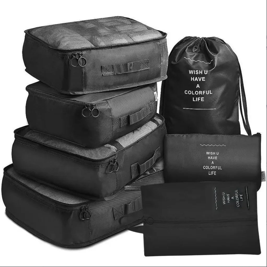 A set of seven black folding travel organizer bags and a storage pouch.