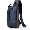 A dark blue anti-theft zippered crossbody bag with brown accents shown from the back.