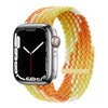 Apple Watch with an orange and yellow braided stretch band on a white background.