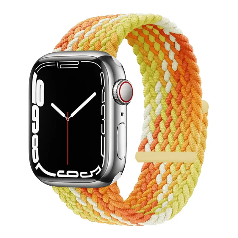 Apple Watch with an orange and yellow braided stretch band on a white background.