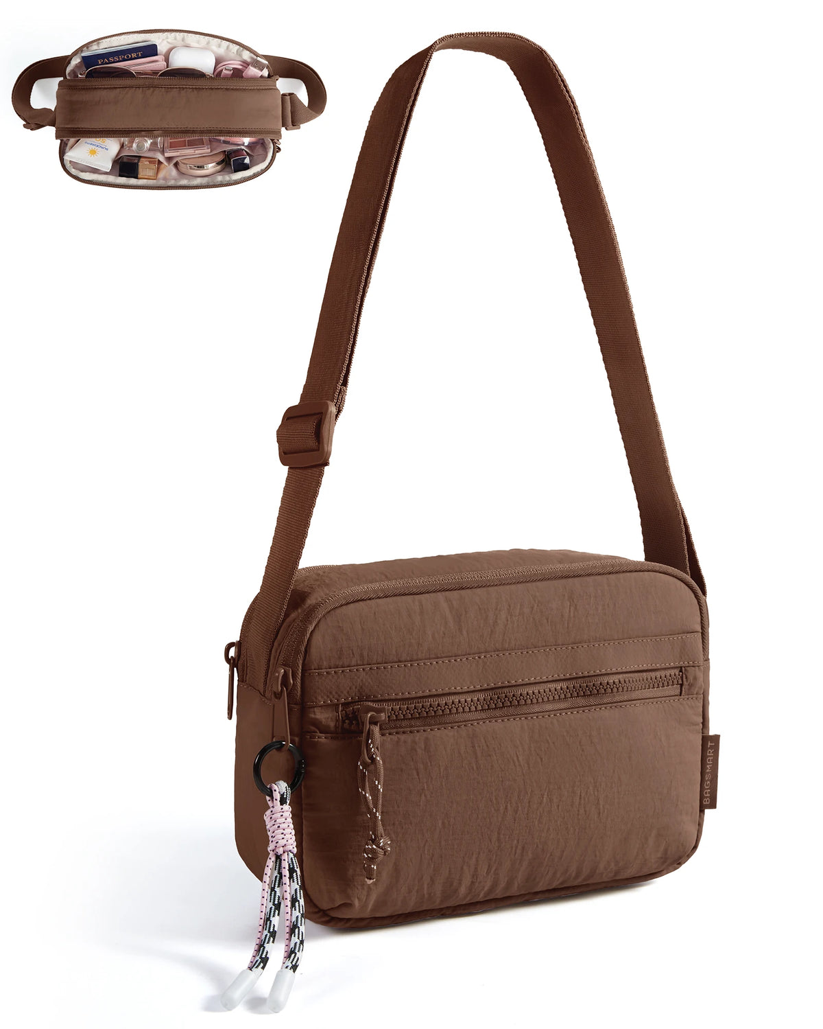 A brown crossbody shoulder bag with a leather strap and decorative tassel detail.
