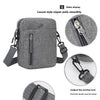 A gray nylon crossbody shoulder bag with a zipper display and adjustable strap features a mortise lock design.