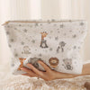 A light gray patterned corduroy makeup storage pouch featuring cute animal illustrations.