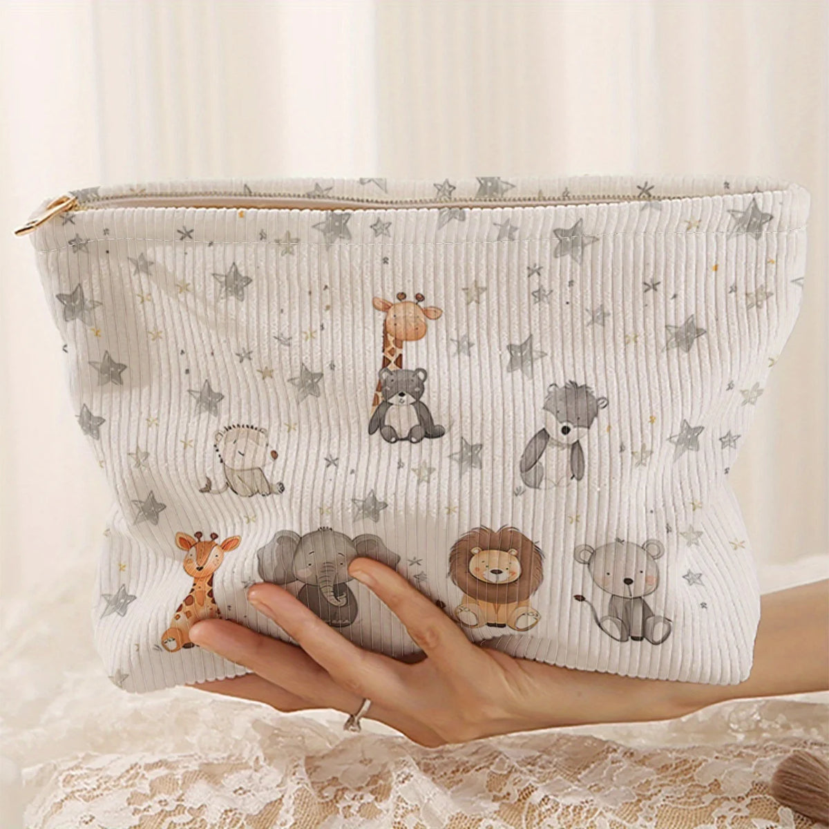 A light gray patterned corduroy makeup storage pouch featuring cute animal illustrations.
