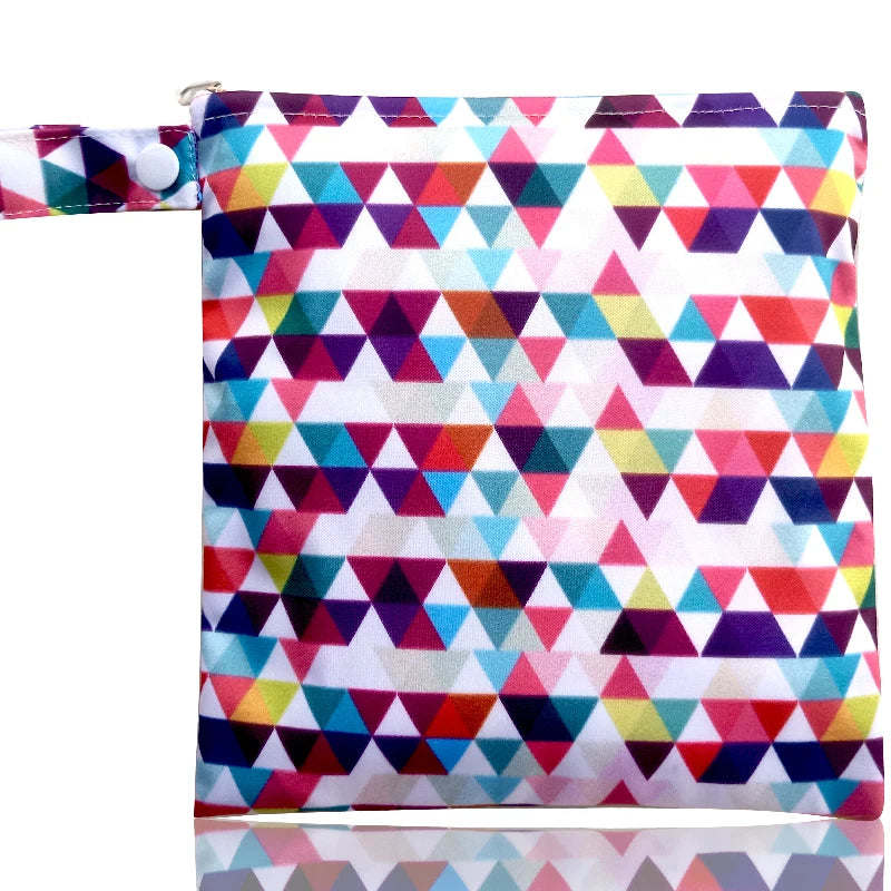 A colorful, patterned reusable waterproof snack bag with a zipper closure.
