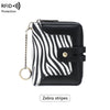 Black and white zebra striped RFID protected bi-fold wallet with a gold chain.