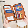 A brown RFID blocking travel wallet is shown open, displaying various passport and credit cards.