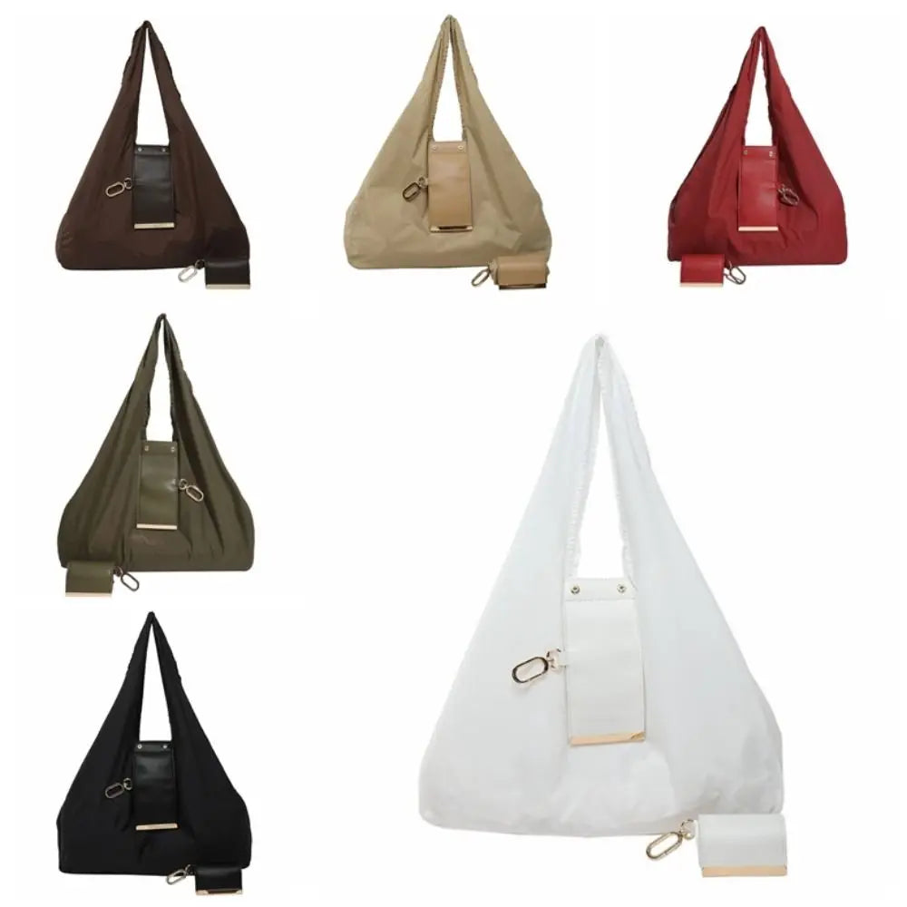A collection of reusable nylon mini keychain tote bags in brown, beige, red, olive green, and black.